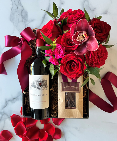 red floral arrangement with wine